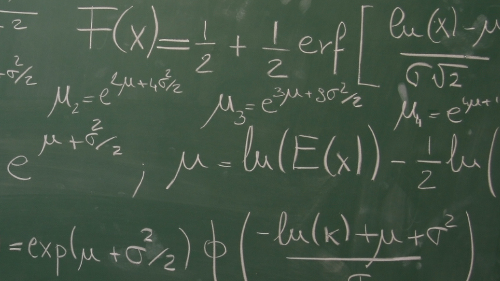 Chalk board with writing on it.