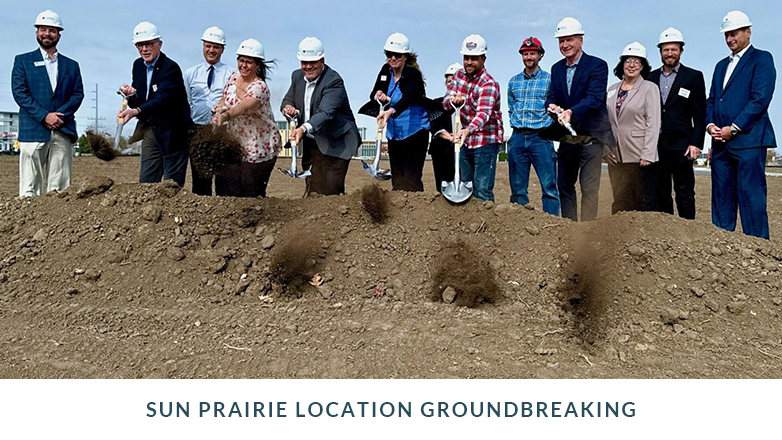 JFG associates breaking ground by shovel at new location.